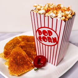 doritos nacho with popcorn and tortilla chips served in the white plate