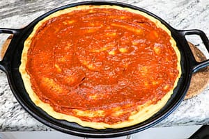 Oil-free Pizza Sauce spread on a pizza base