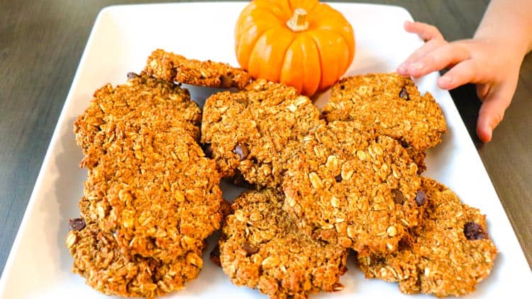 Daughter trying to steal a pumpkin oatmeal cookie