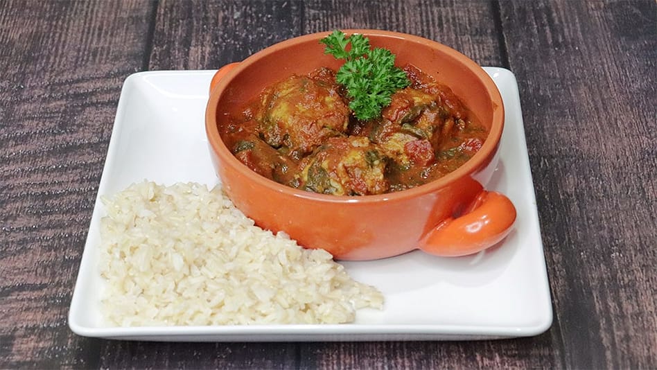 Vegan Chickpea Dumplings in Curried Tomato Sauce Over Brown Rice