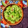 tasty guacamole with tomatoes
