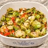 Mediterranean Brussel Sprouts served in a white baking pot