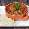 Vegan Chickpea Dumplings in Curried Tomato Sauce Over Brown Rice