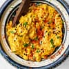 curry hummus served in a traditional bowl from Moroco