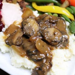 Mushroom Gravy served with rice,some beans and peppers on the side