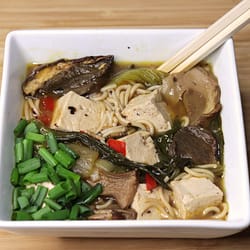 Spicy Ramen Noodles with Tofu or Chicken served in the white plate