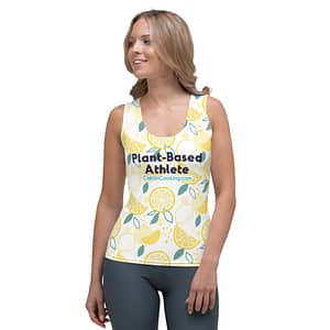 Female model in athletic shirt with yellow lemons, logo and inscription "Plant-based Athlete" CaitlinCooking.com