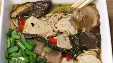 Spicy Ramen Noodles with Tofu or Chicken served in the white plate