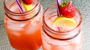 Two jars full of Strawberry Detox Lemonade