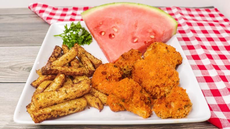 buffalo cauliflower with watermelon on a white plate 