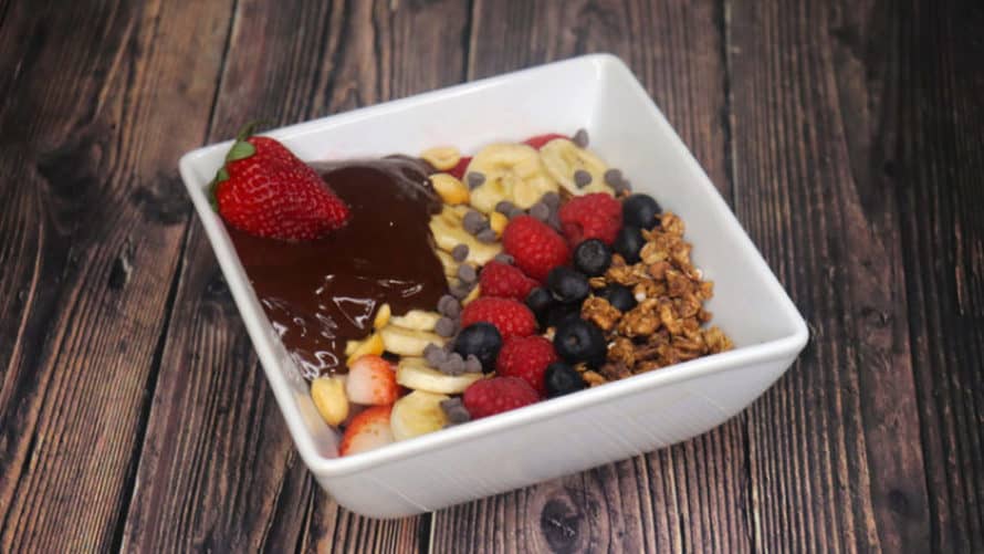 Whipped Coffee Chocolate Bowl with Coconut Milk and blueberries, strawberries, banana and raspberries on the top